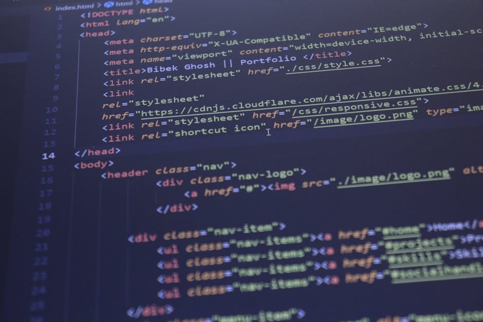 A computer screen displaying a code editor with an open HTML file named 'index.html.' The code includes tags such as <html>, <head>, <meta charset=